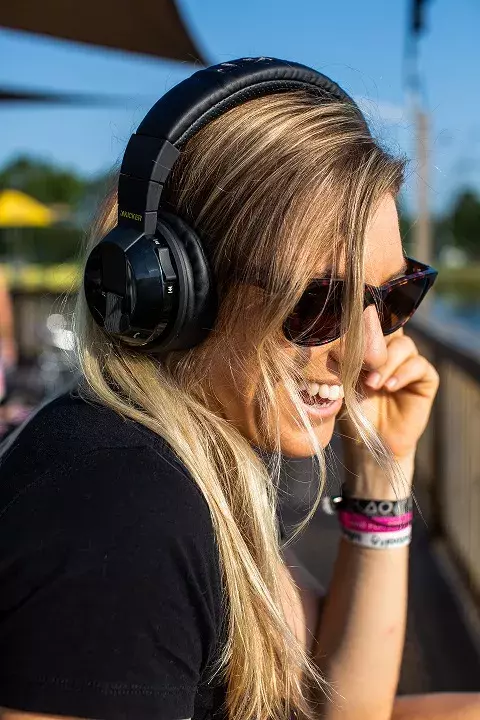 Girl listening to Kicker headphones. Girl listening to Kicker headphones.