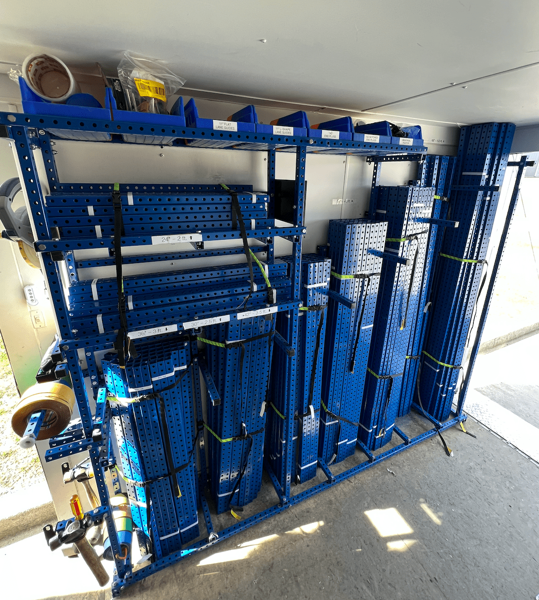 Precut steel tube storage inside of Kaizen Trailer