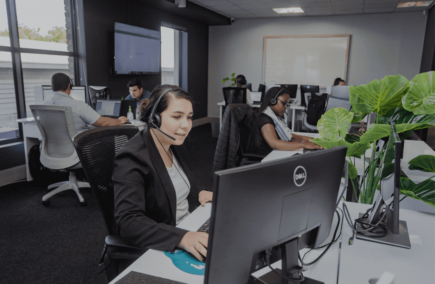 Team members at DSL Telecom providing online store customers with support