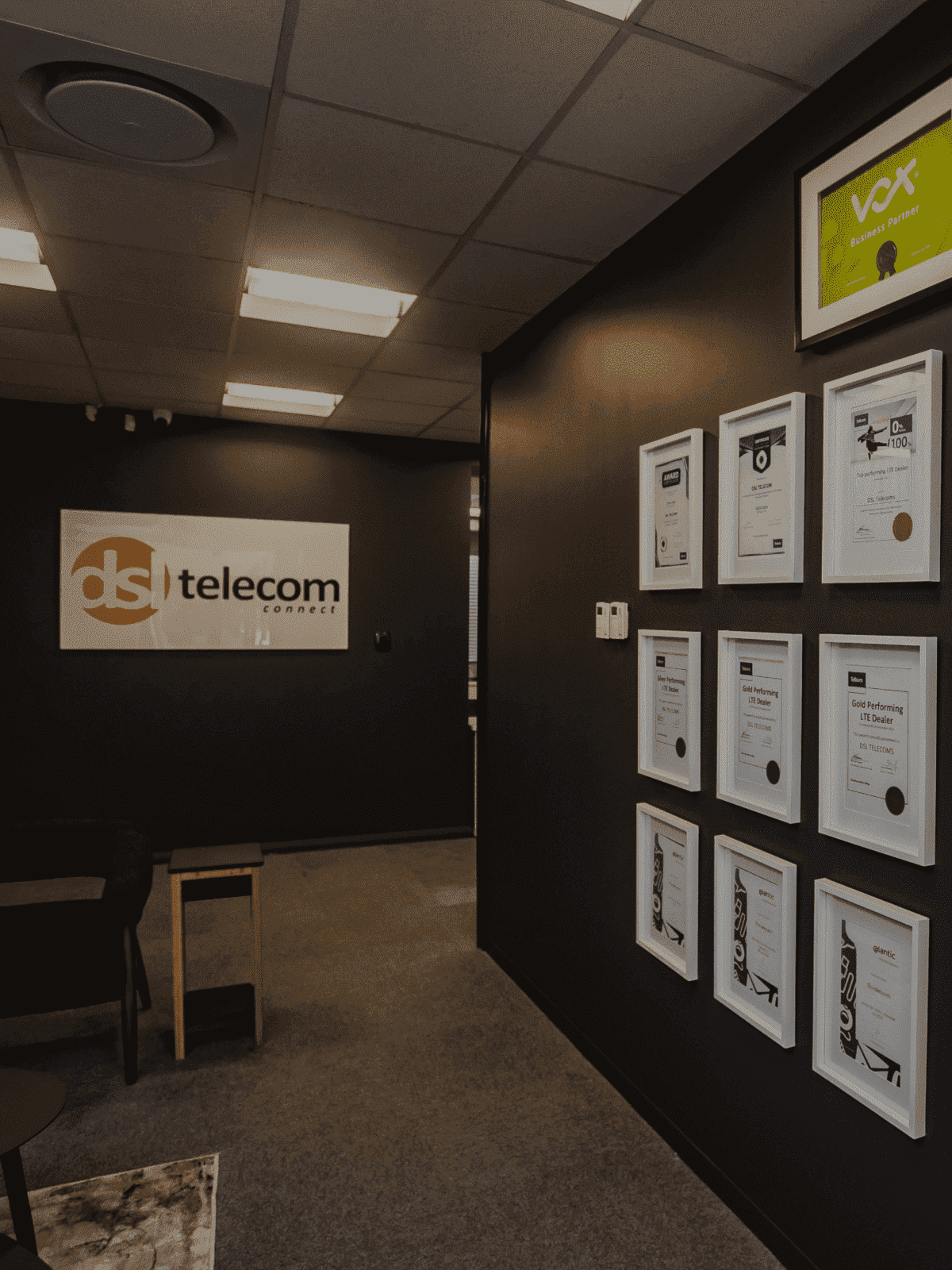 DSL Telecom office entrance with awards and the company logo
