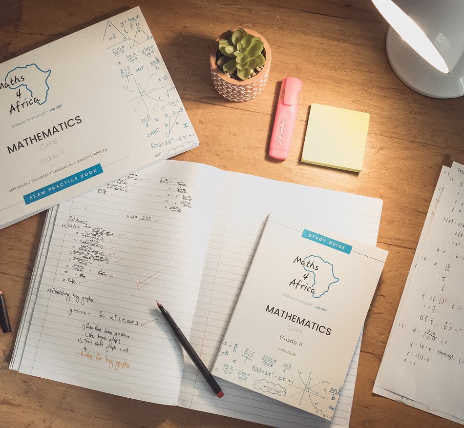 Maths for Africa study guide on a desk, South Africa exam practice resource.