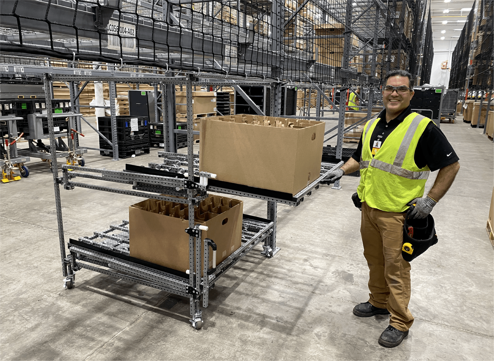 Parts cart with pullout shelf and flow rack conveyors.