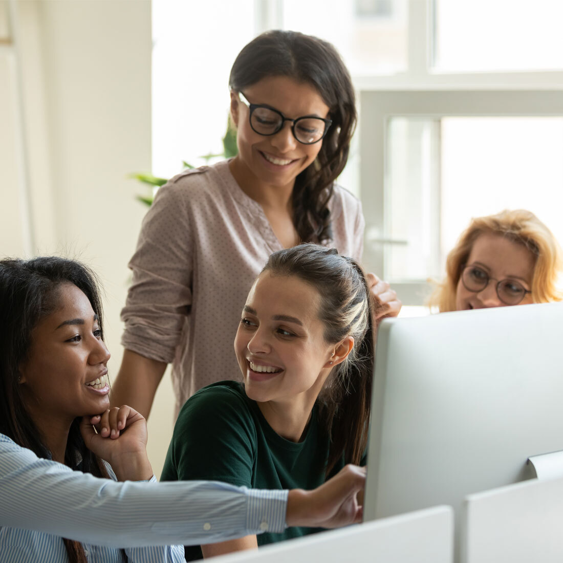 Women having meeting in front of computer