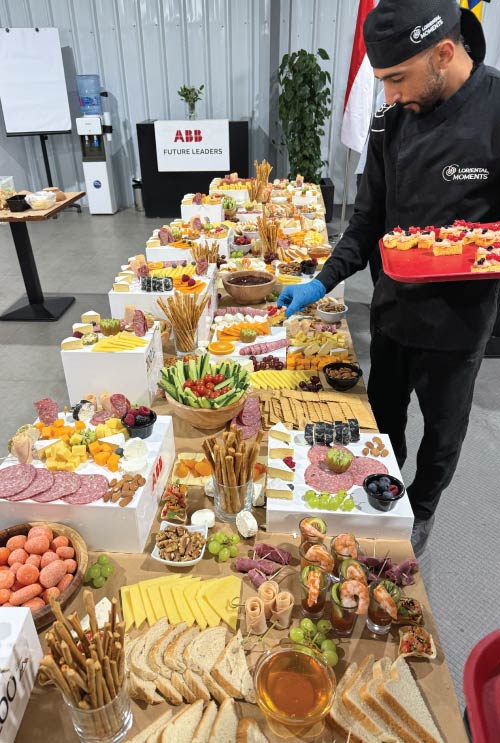 LOriental chef preparing ABB grazing table