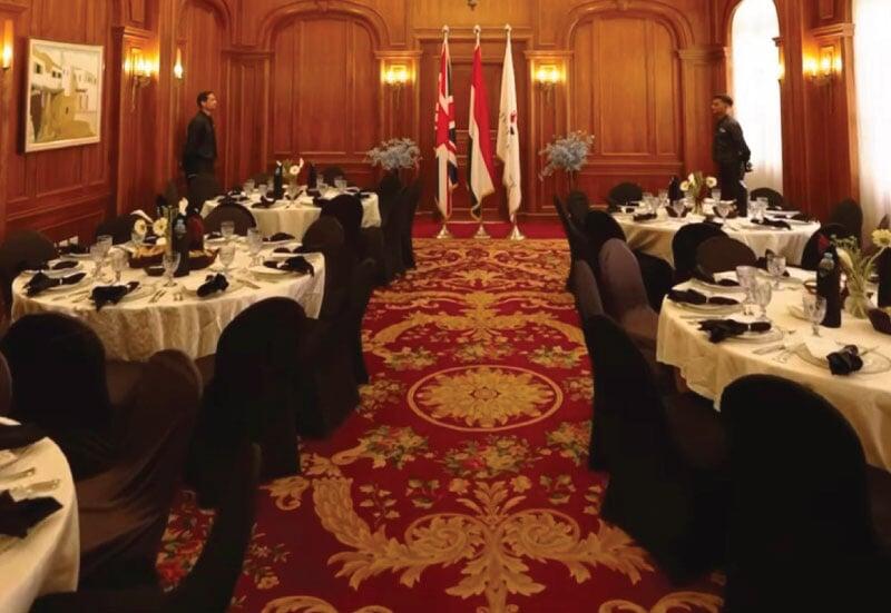 LOriental waiters getting ready for service at British University in Egypt seated lunch event