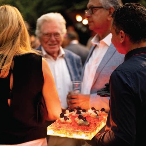 LOriental theatrical pass-around tray at Canada Day 2026 with Egyptian actor Hussein Fahmy in the background LOriental theatrical pass-around tray at Canada Day 2026 with Egyptian actor Hussein Fahmy in the background