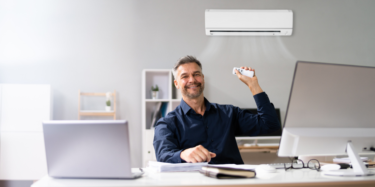 A white 3 ton split AC indoor unit mounted on a spacious living room wall.