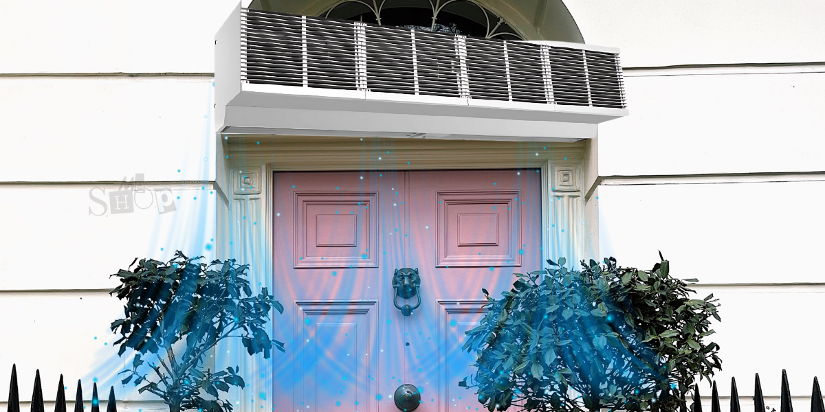 Sleek commercial air curtain installed above a glass door entrance. Sleek commercial air curtain installed above a glass door entrance.