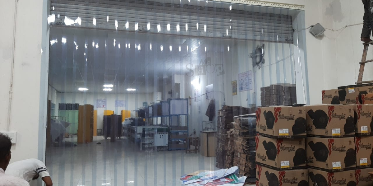 Buzz Lite clear PVC strip curtain installed in an industrial doorway.