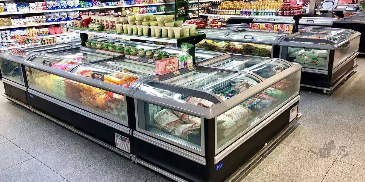 Sleek island display freezer with sliding glass tops for retail.