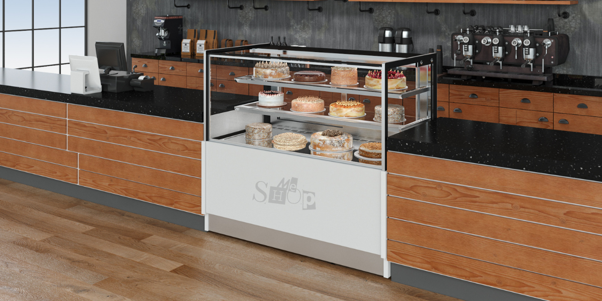 Three-tiered glass pastry showcase chiller filled with delicious assorted desserts. Three-tiered glass pastry showcase chiller filled with delicious assorted desserts.