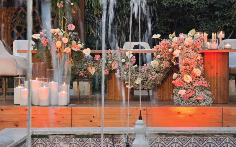 Ceremony table with intense floral runner with Manial Palace pergola fountain Ceremony table with intense floral runner with Manial Palace pergola fountain