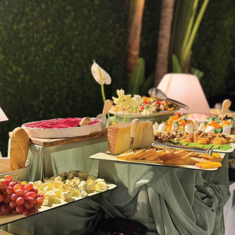 LOriental cheese and charcuterie buffet with artisan cheeses, fruit and accompaniments LOriental cheese and charcuterie buffet with artisan cheeses, fruit and accompaniments
