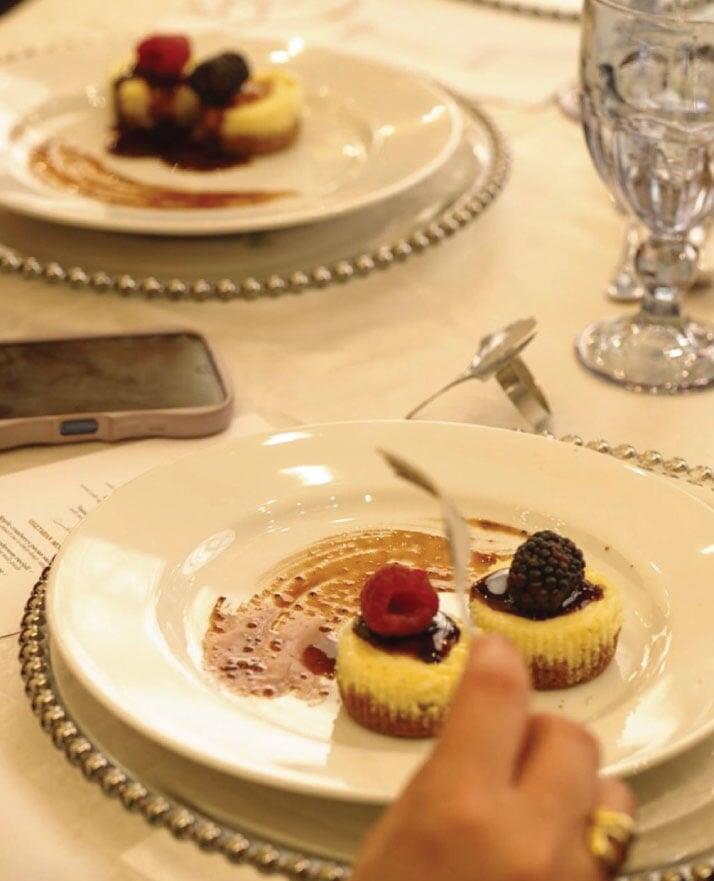 Close-up shot of cheesecake dessert course at a seated lunch event at the British University in Egypt
