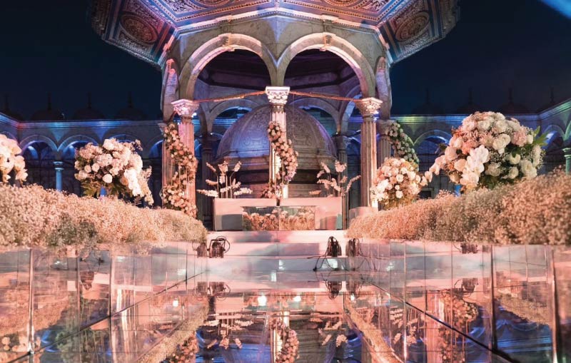 Katb Ketab ceremony setup at Cairo Citadel with floral aisle and historic architecture, catered by LOriental Moments