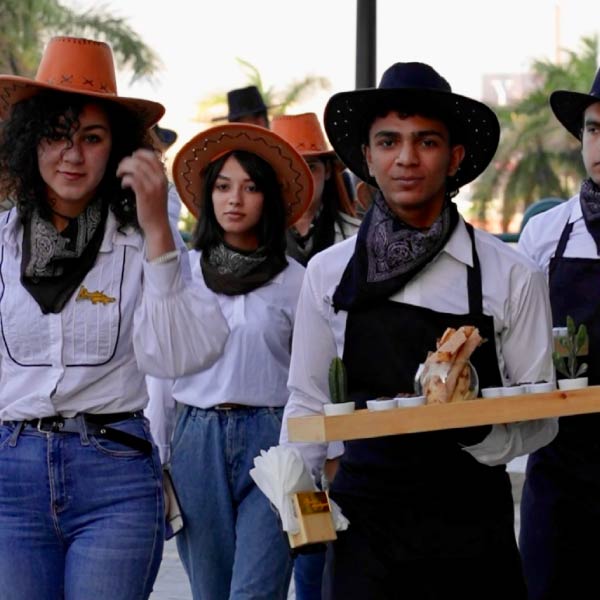 LOriental service team in cowboy uniform at Dell OneJourney