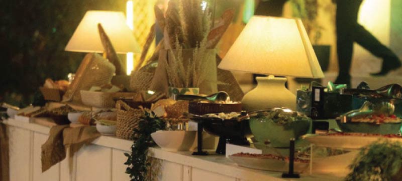 Styled Dînatoire buffet with breads, small plates and ambient table lamps