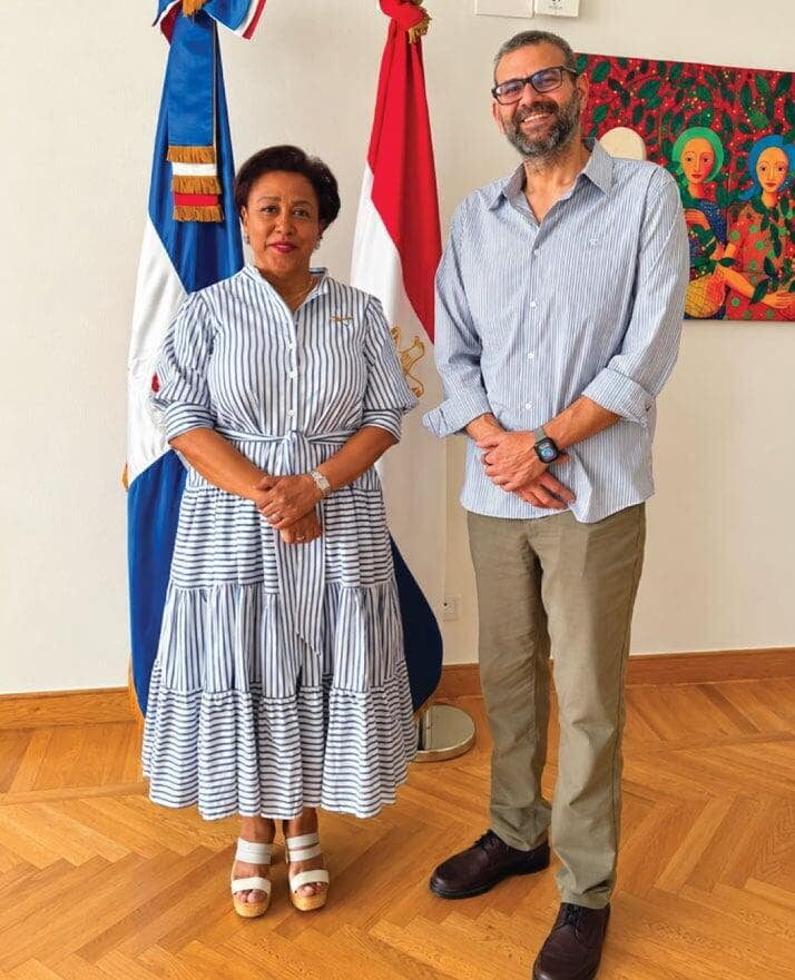 LOriental CEO with Dominican Republic Ambassador to Egypt Ysset Caridad Román Maldonado during event setup at the official residence, beside the Egyptian and Dominican flags. LOriental CEO with Dominican Republic Ambassador to Egypt Ysset Caridad Román Maldonado during event setup at the official residence, beside the Egyptian and Dominican flags.