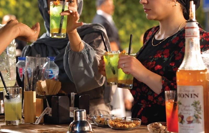 Guests enjoying freshly prepared mocktails at an LOriental non-alcoholic bar Guests enjoying freshly prepared mocktails at an LOriental non-alcoholic bar