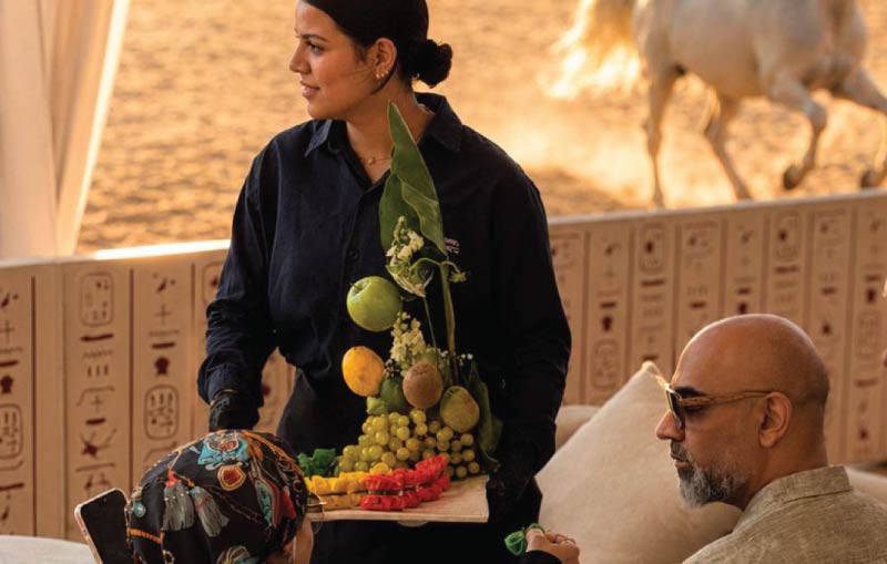 LOriental theatrical pass-around with sculptural fruit presentation beside Arabian horses at ASEEL Egyptian Horse Festival in Cairo LOriental theatrical pass-around with sculptural fruit presentation beside Arabian horses at ASEEL Egyptian Horse Festival in Cairo