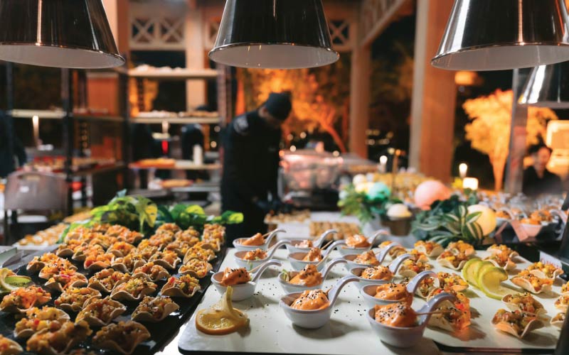 LOriental BOH open kitchen at GIZ event showing chefs preparing passaround trays