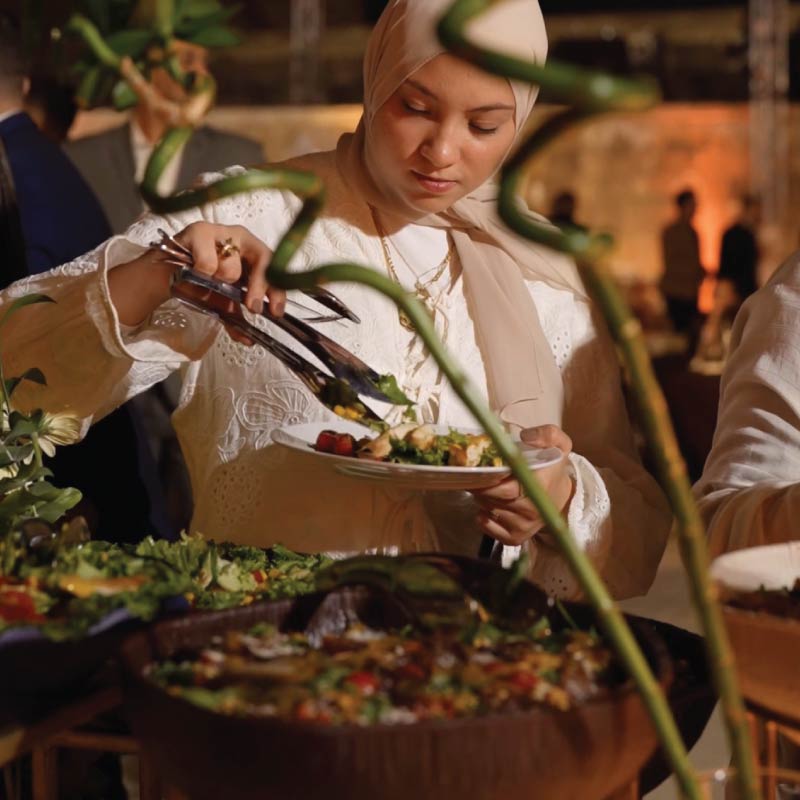 Guest at salad buffet Guest at salad buffet