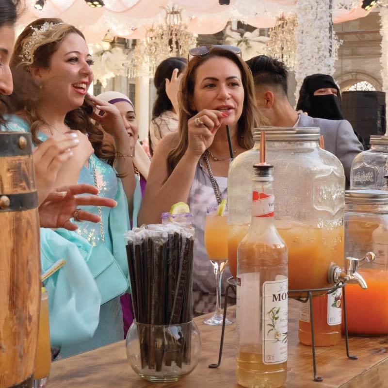Guests gathering around the LOriental Live Bar during a Katb Ketab event in Mohamed Ali Mosque in Citadel