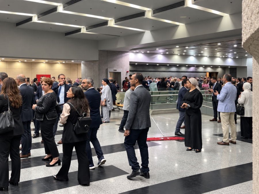 Guests during service at standing reception at NMEC