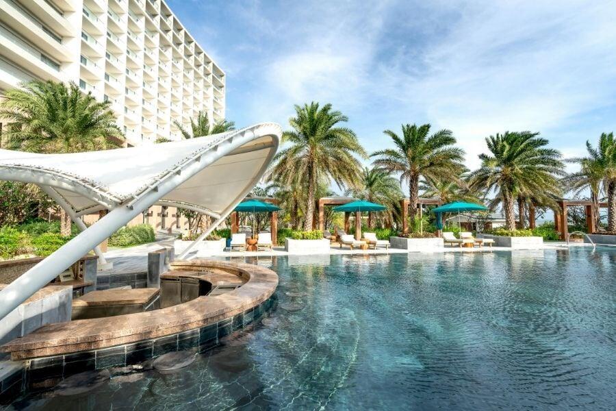 Luxury resort pool area representing keyless access control for hotels and hospitality properties