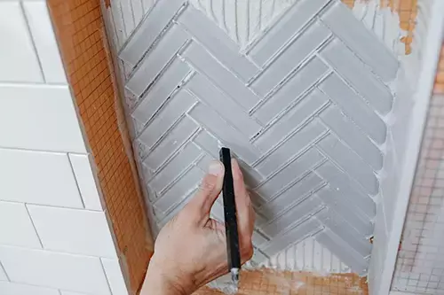 ThinStick used for grout trimming wall tile.