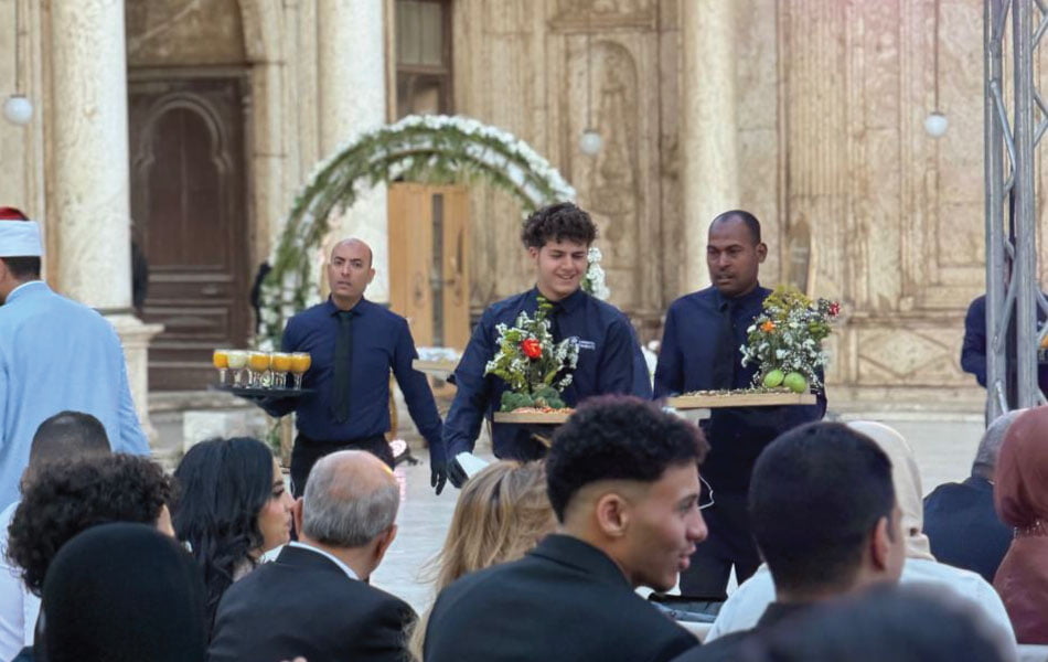 LOriental waiters serving experiential passarounds at Mohamed Ali Mosque