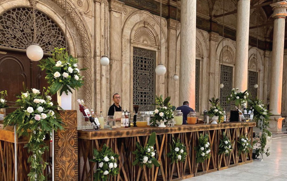 LOriental barista behind decorated live bar setup at a Katb Ketab event in Mohamed Ali Mosque Courtyard on 28 October 2023 LOriental barista behind decorated live bar setup at a Katb Ketab event in Mohamed Ali Mosque Courtyard on 28 October 2023