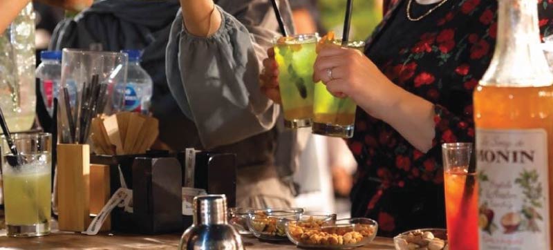 Bartender preparing a fresh non-alcoholic cocktail at an LOriental live bar