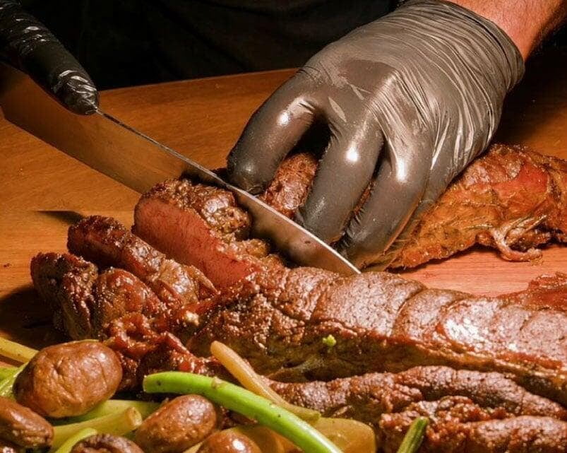 Chef slices through full tenderloin roast