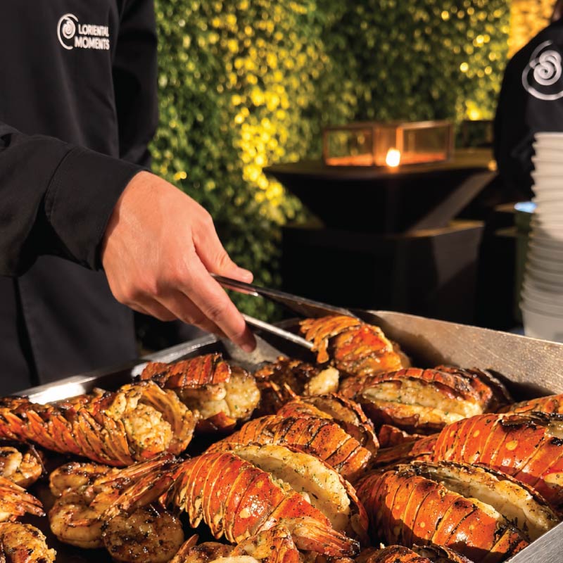 Grilled lobster tails and shrimp served fresh in LOriental live station at Grand Experience event in Sept 2026