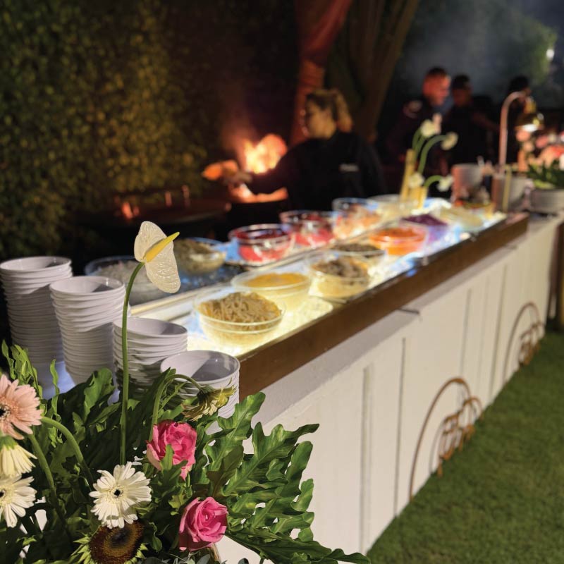 LOriental outdoor buffet experience with floral styling and live food stations