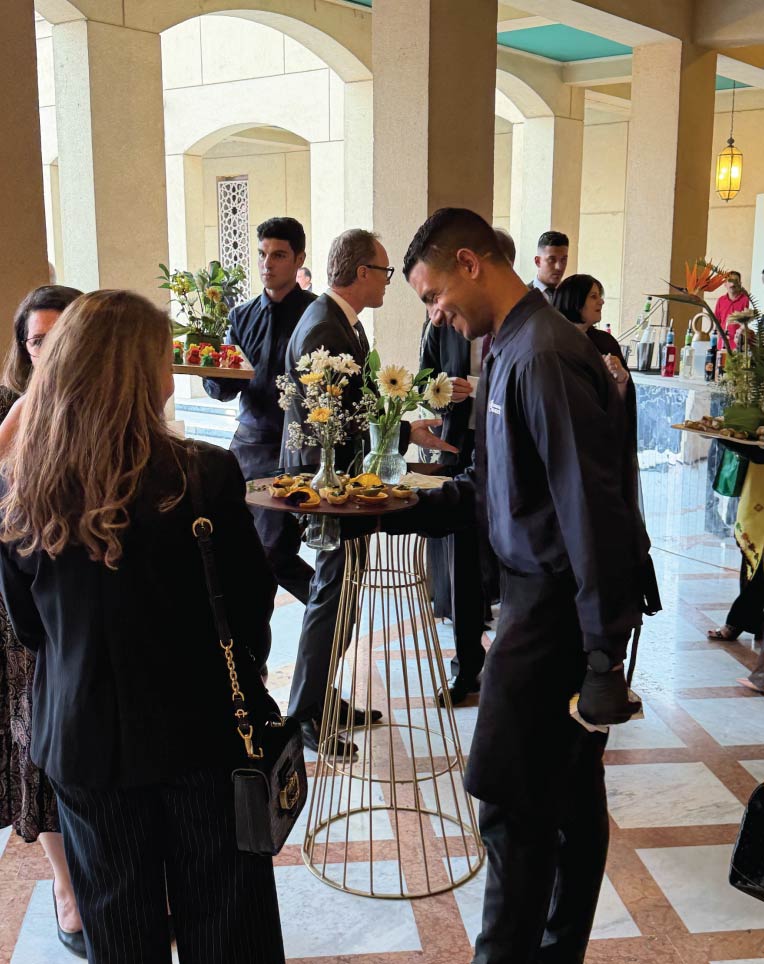 LOriental waiters serving passarounds at cocktail reception event in Cairo Opera House