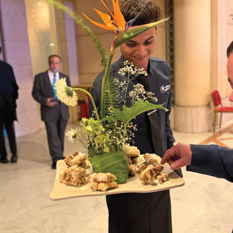 LOriental waiter serving theatrical passarounds at an event in Cairo Opera House LOriental waiter serving theatrical passarounds at an event in Cairo Opera House