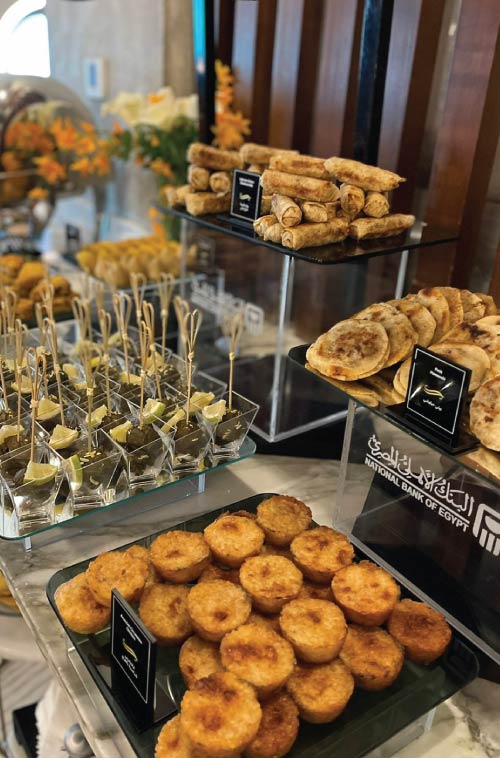 NBE Platinum lounge snacks on buffet with visible NBE branding on food risers