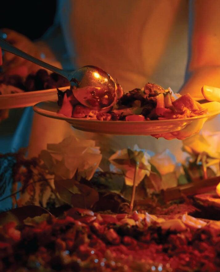 Guest being served at an open buffet Guest being served at an open buffet