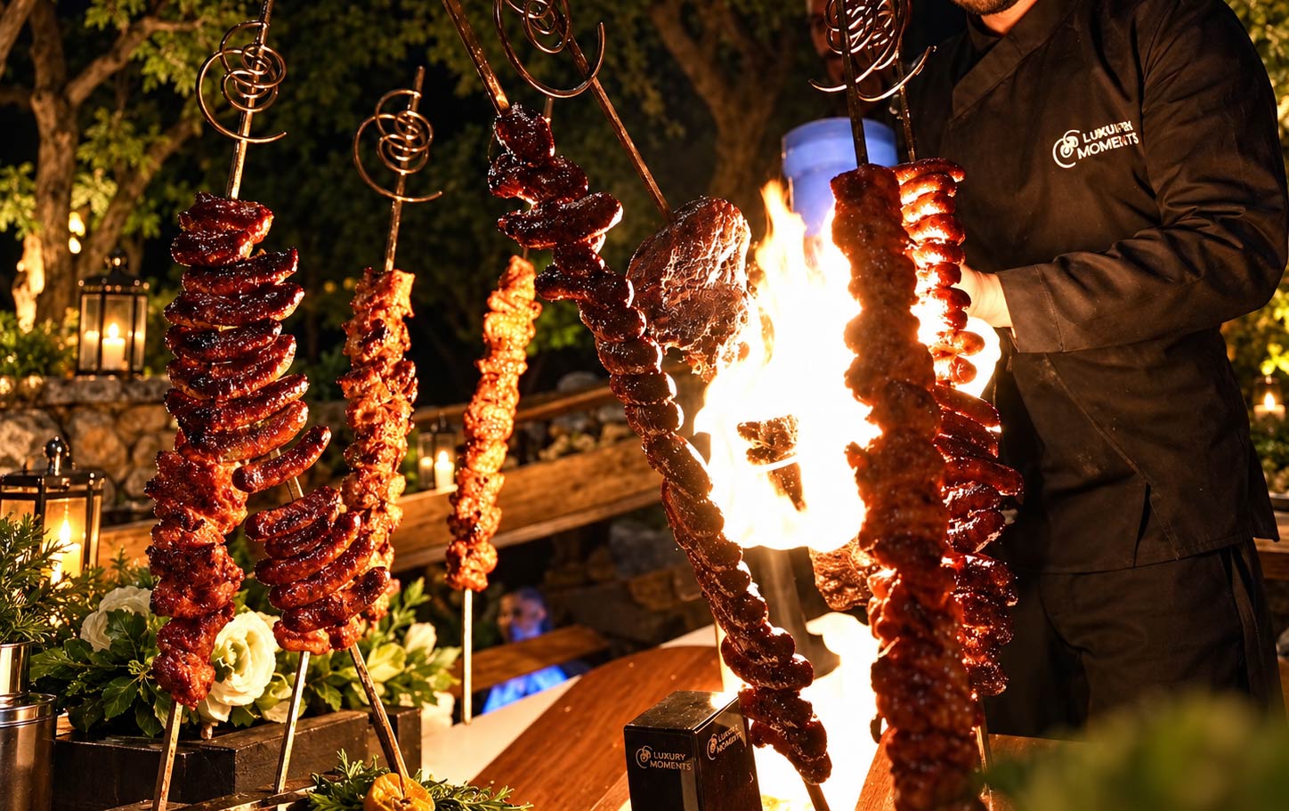 Theatrical live fire station with suspended grilled meats at an LOriental open buffet Theatrical live fire station with suspended grilled meats at an LOriental open buffet