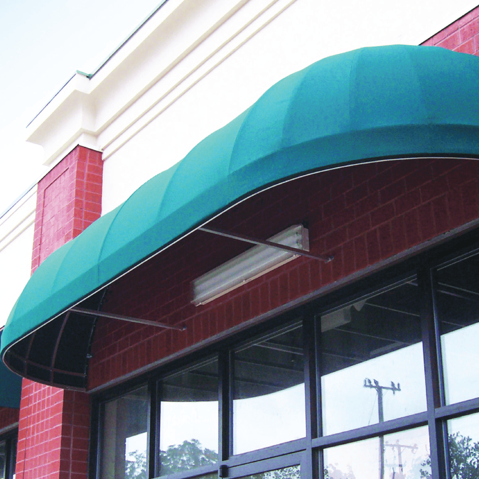 013 Quarter Round with Globe Ends awning canopy, crafted in premium fabric by MG Sign — a leading signage company in New York and New Jersey