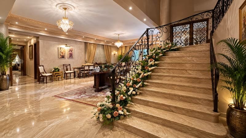 Private home before an engagement, floral arrangements on marble staircase