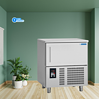 Chef placing food trays into a Blue Star BF05G Blast Freezer. Chef placing food trays into a Blue Star BF05G Blast Freezer.