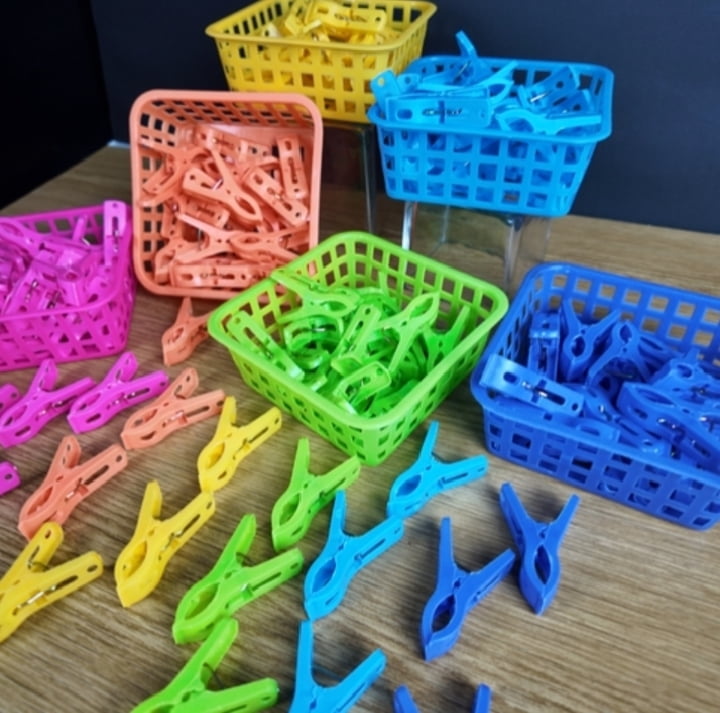 PLASTIC CLOTHES DRYING CLIPS WITH STORAGE BASKET