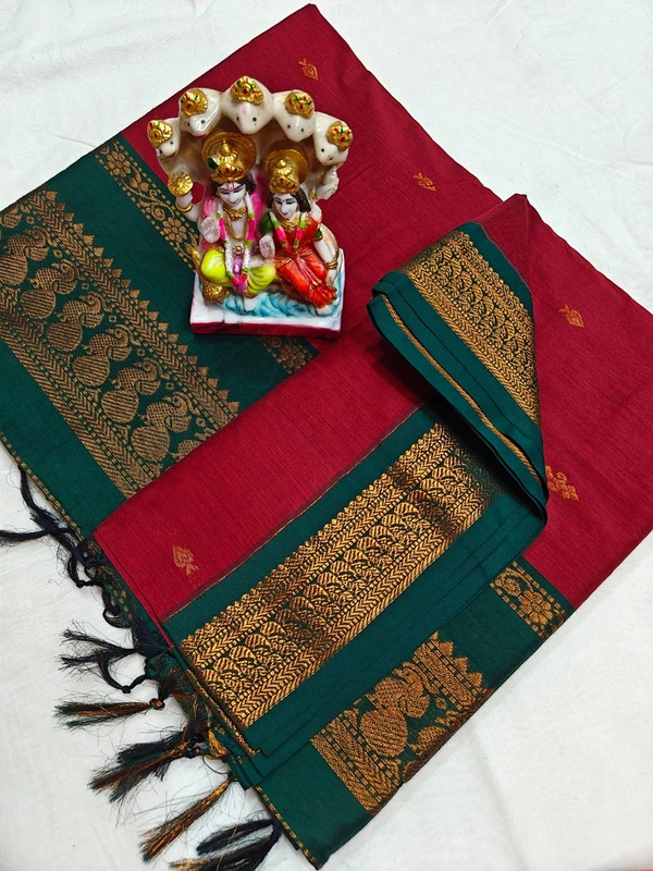 Kalyani cotton blend with a maroon body and contrasting dark green border and pallu.