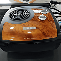 op view of Usha FH 1212 showing two adjustable knobs for heat setting and fan speed. op view of Usha FH 1212 showing two adjustable knobs for heat setting and fan speed.