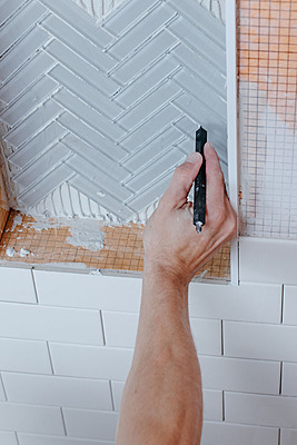 ThinStick grout cleaning tool for narrow tile gaps.
