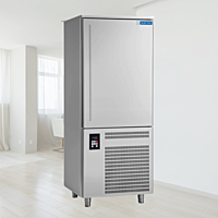 Chef placing food trays into a Blue Star BF10G Blast Freezer.