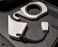 SOG Rapid Rescue Multi-Tool | Stainless Steel Seatbelt Cutter, GRN Handle, Aluminum Pull-Ring, Quick to Deploy from The Sheath Concrete Dust